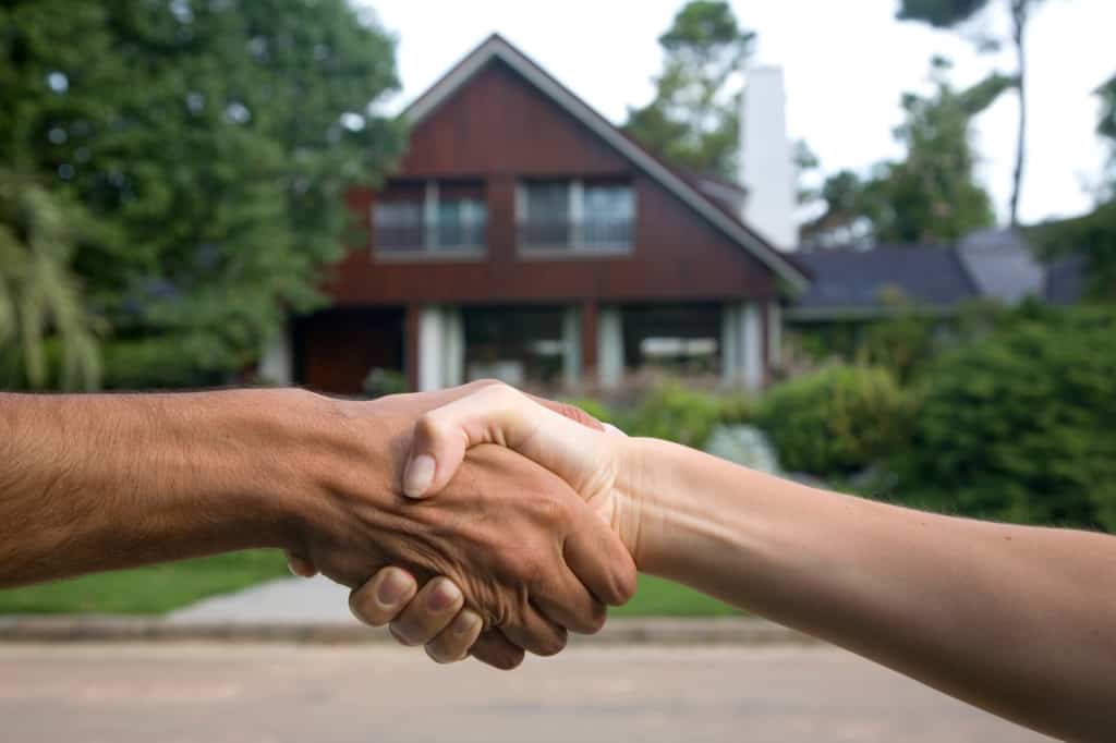 Shaking Hands with New Mowing Client
