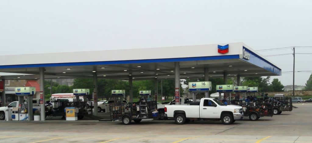 Lawn trucks and trailers at the gas station