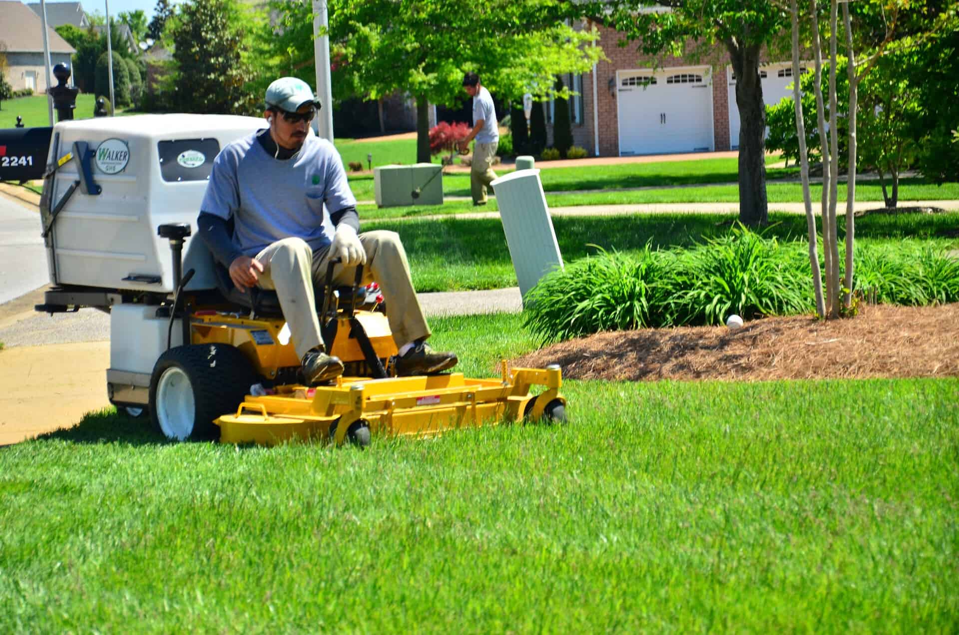 riding lawn mower over green field