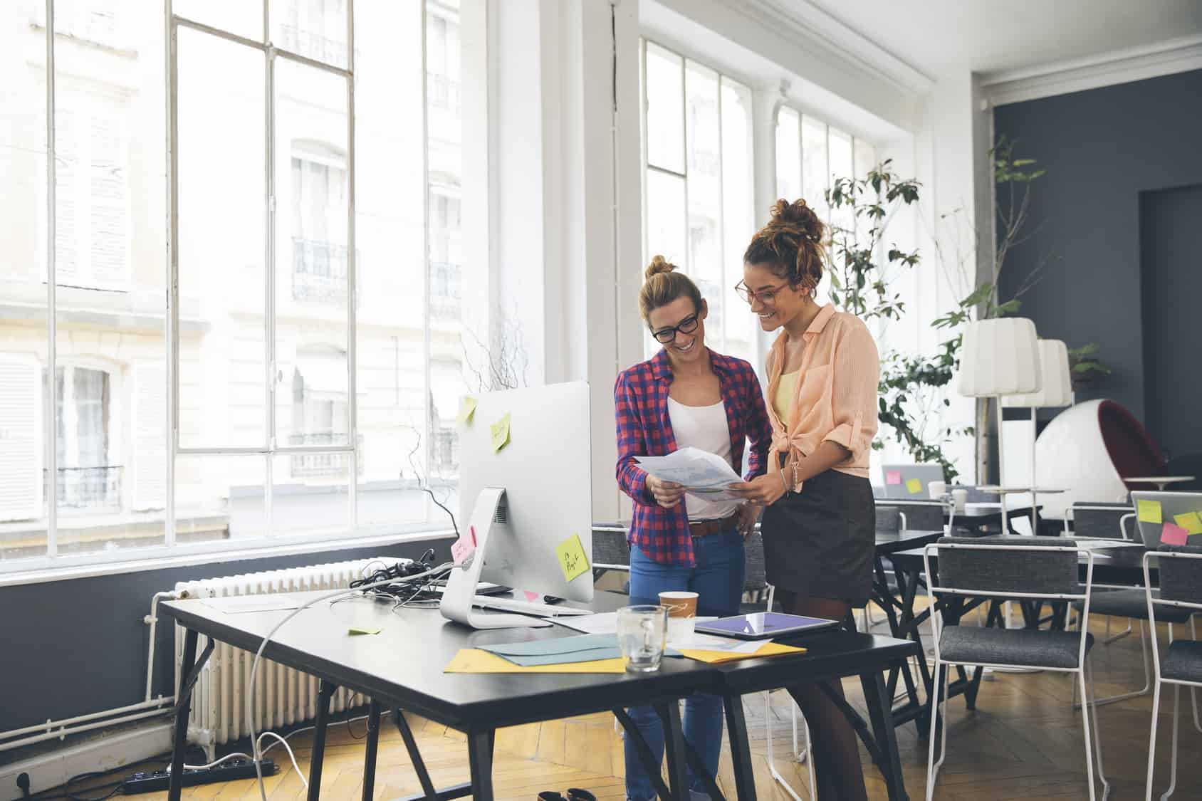 Two women working together in office