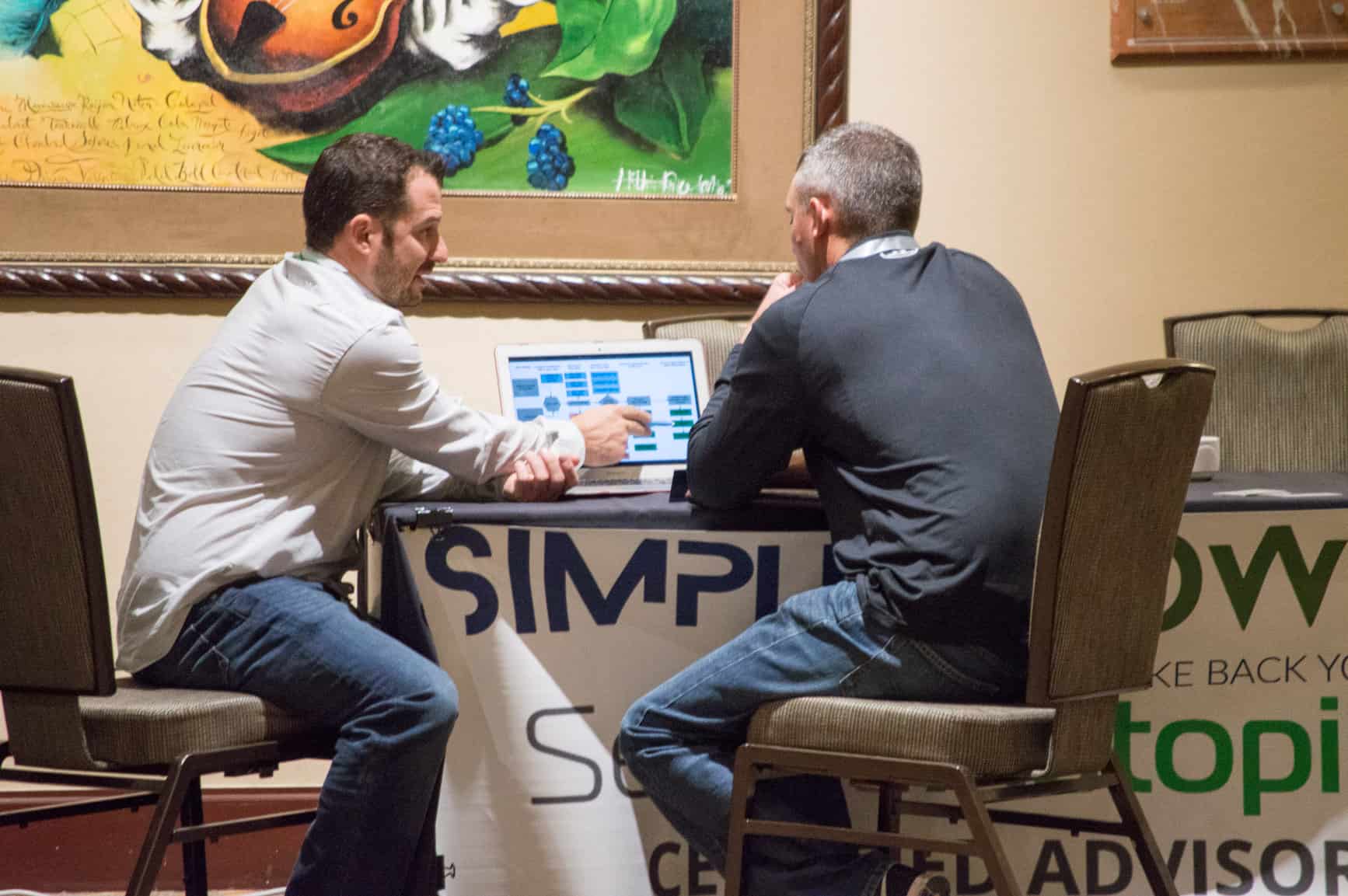 Mike Callahan helping out a Member at the SimpleGrowth Booth.
