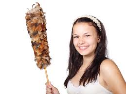 happy-cleaning-employee-with-duster
