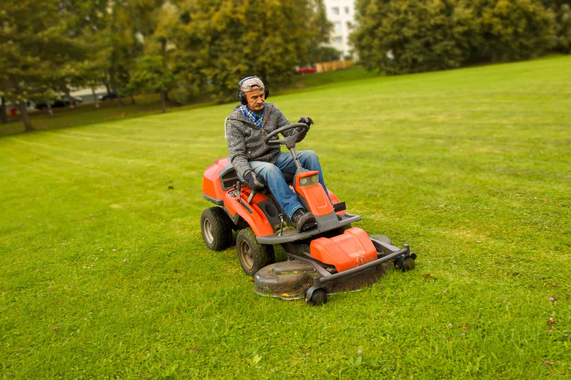Man Riding Lawn Mower Service Autopilot